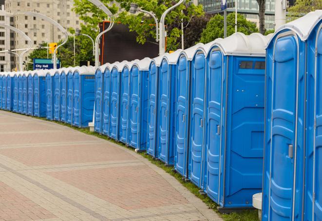 a row of portable restrooms at a fairground, offering visitors a clean and hassle-free experience in lovington